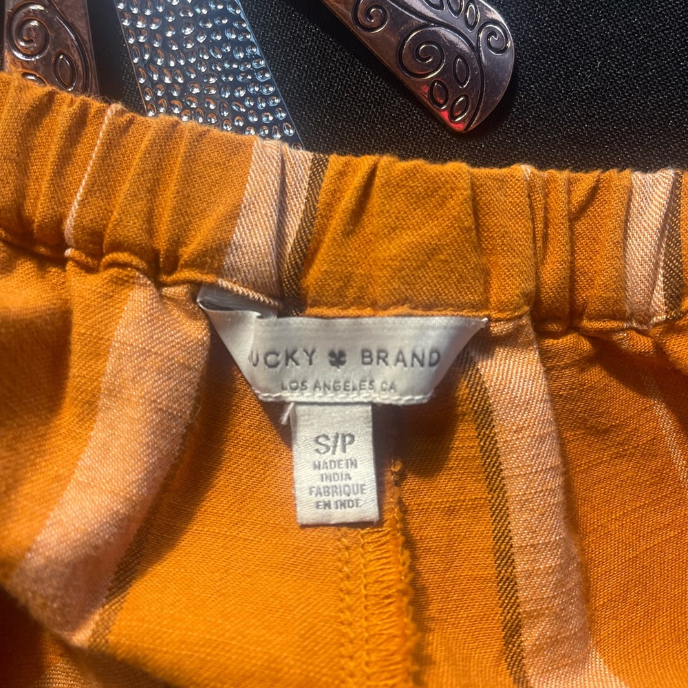 Tan striped ankle length jumper. Size SP